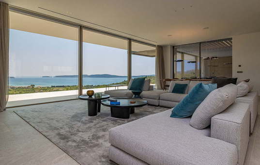 Griechenland - PELOPONNESE -  - Villa Birdie - modern living room with sliding doors to the terrace with sea view